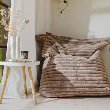 Cocooning en hiver : pourquoi choisir un pouf tout doux ?
